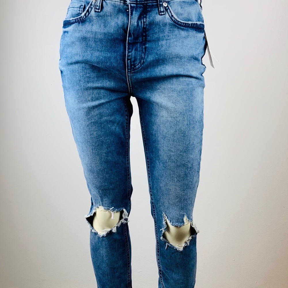 Free People distressed blue jeans.